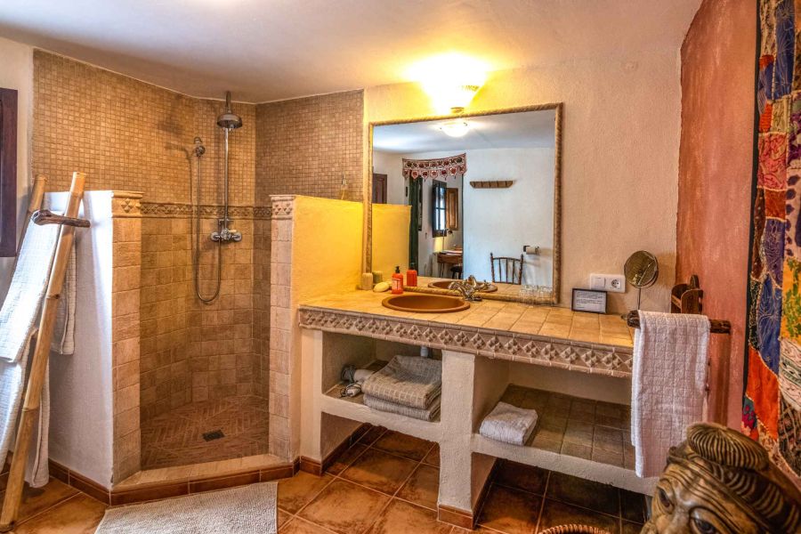 ample bathroom with walk in shower